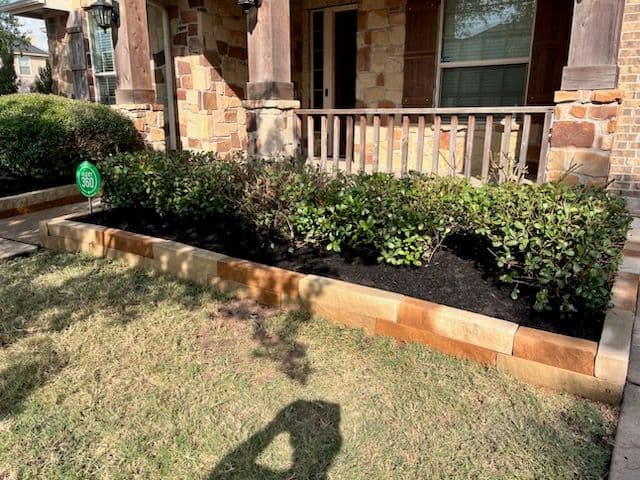 Stunning Front Yard Transformation with Stone Borders image