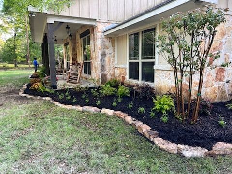 Front Yard Landscaping with Natural Stone and Lush Plantings image
