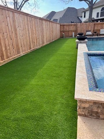 Backyard Transformation with Artificial Turf and Patio Design image